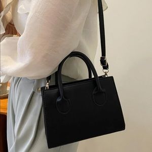Small square black two handle satchel